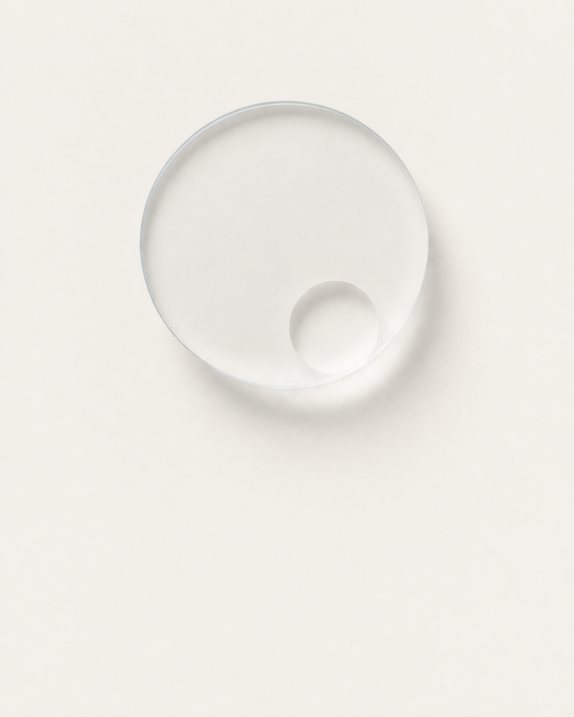 A translucent circular study containing a pale sphere.
